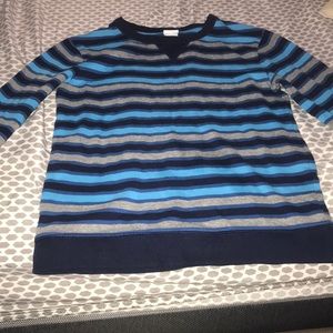 A nice striped teal gray and navy blue shirt
